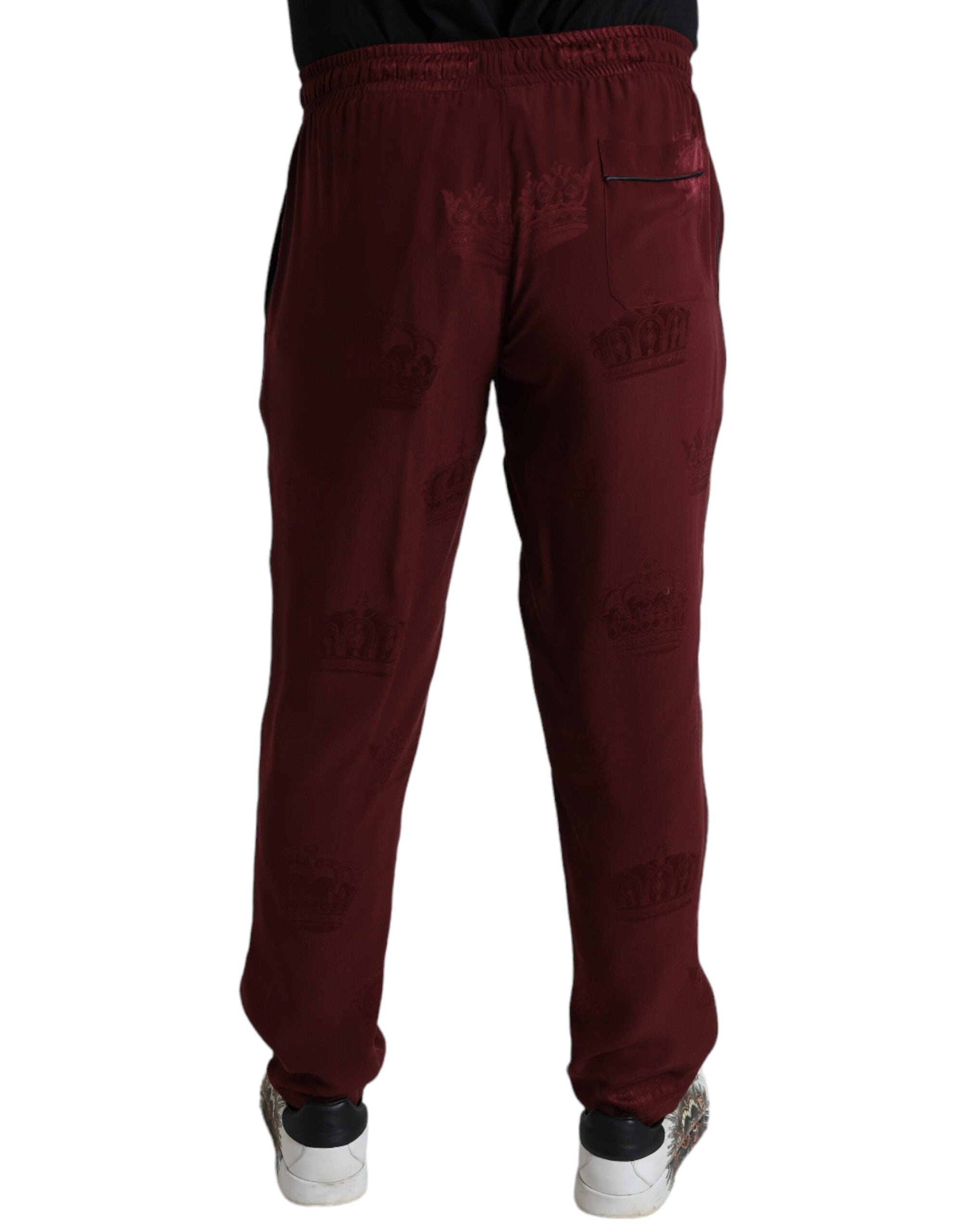 Pantalons de pyjama en soie marron avec motif couronne Dolce & Gabbana, style élégant et confortable.