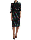Robe midi noire à pois blancs Dolce & Gabbana en coton avec volants et détails élégants, parfait pour une tenue chic.
