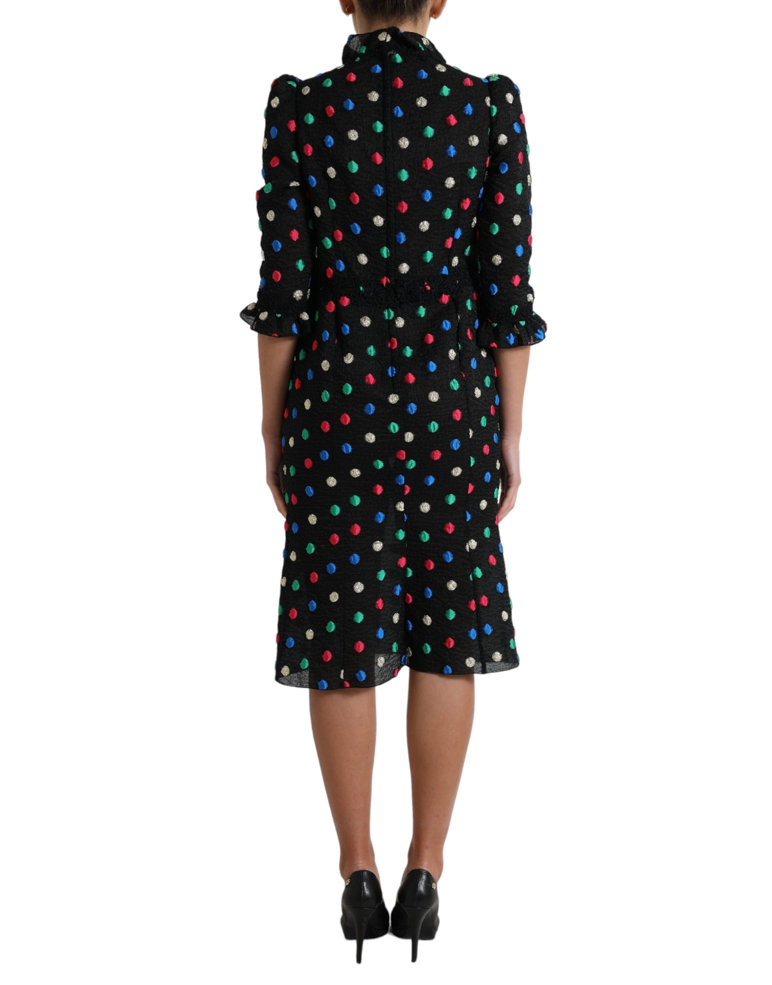 Robe midi en coton noir à pois blancs avec volants, de Dolce & Gabbana, style élégant et féminin.