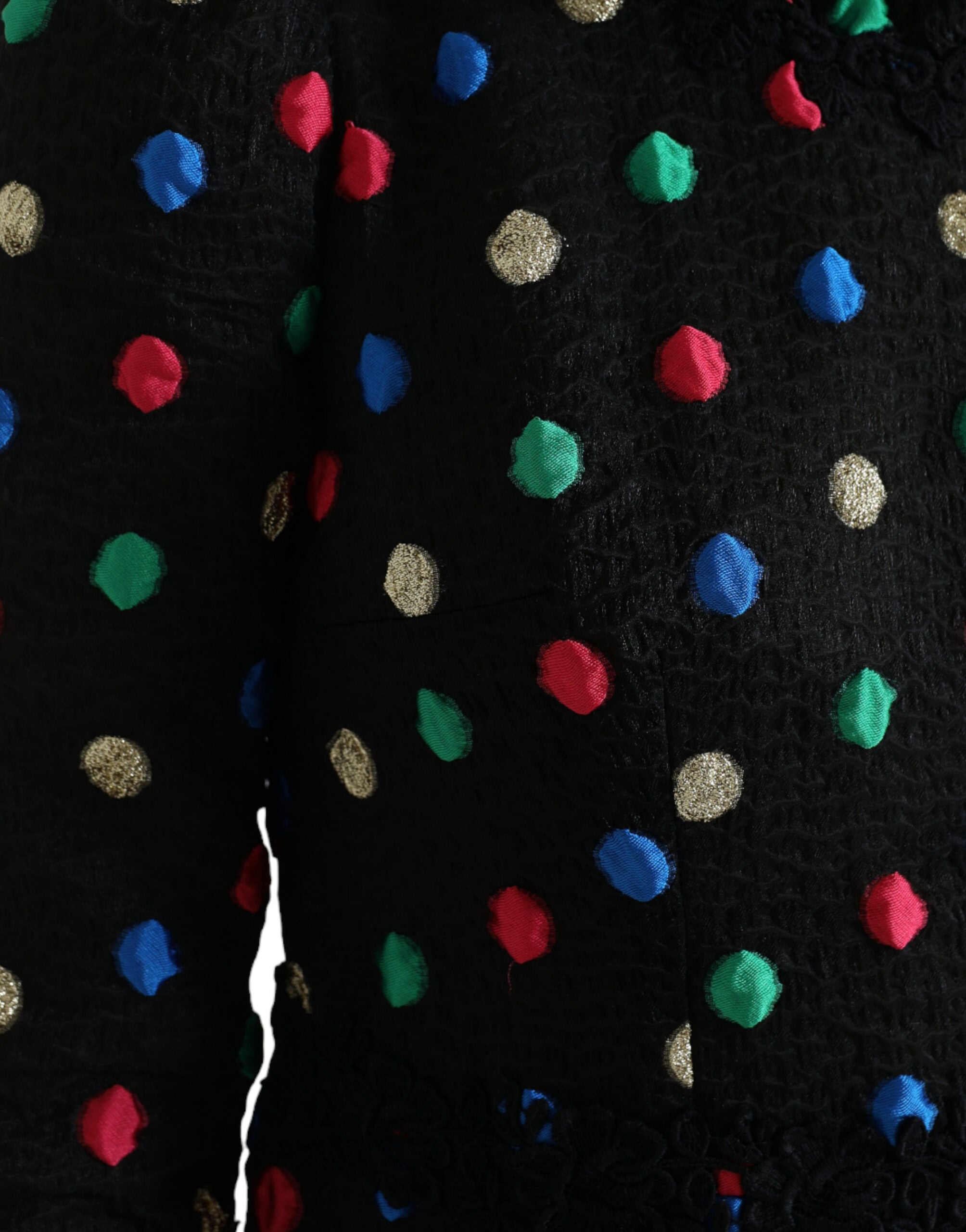Robe midi en coton noir à pois blancs avec volants de Dolce & Gabbana, style élégant et féminin.