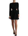 Robe courte noire en viscose avec découpes et manches longues, style A-line Dolce & Gabbana, visible sur l'image.