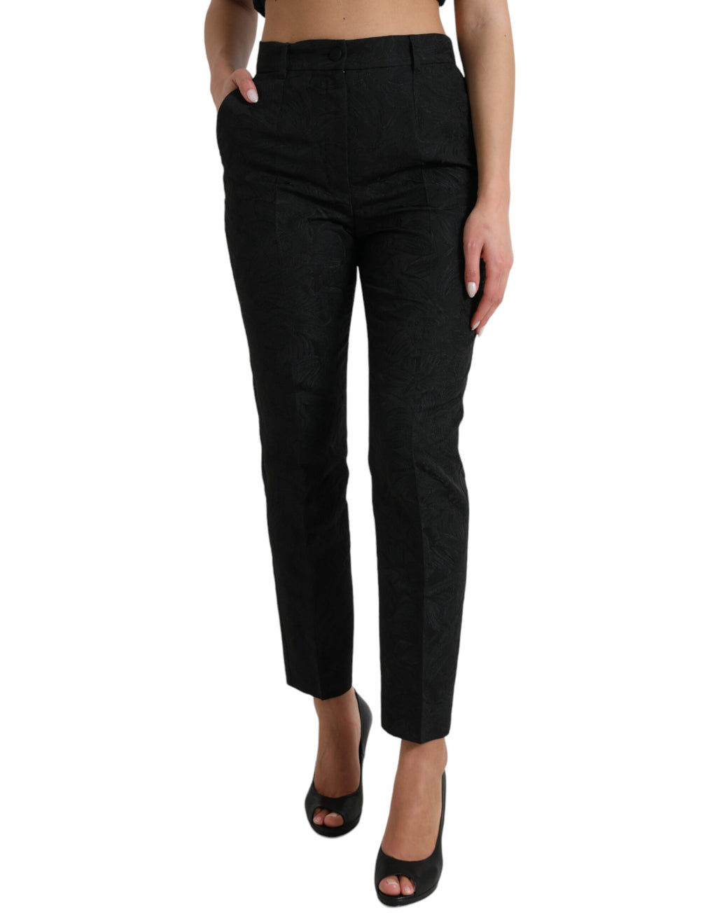 Pantalon noir en polyester à taille haute et coupe tapered, de la marque Dolce & Gabbana, visible en image.