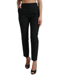 Pantalon noir en polyester à taille haute et coupe tapered, de la marque Dolce & Gabbana, visible en image.