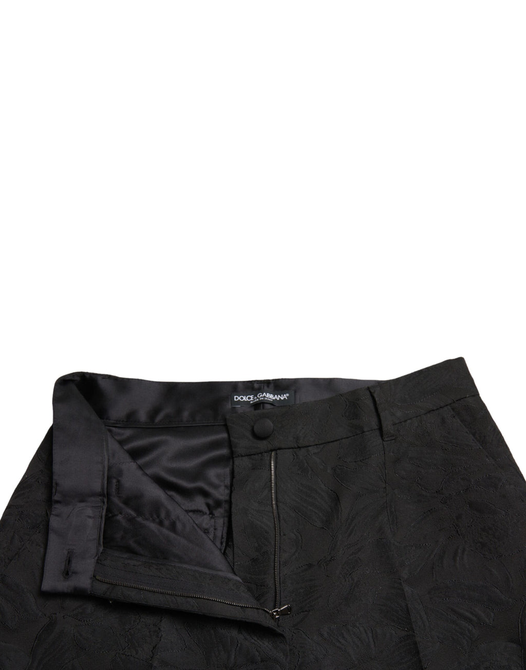 Pantalons noirs en polyester à taille haute et coupe tapered de Dolce & Gabbana, vue de face.