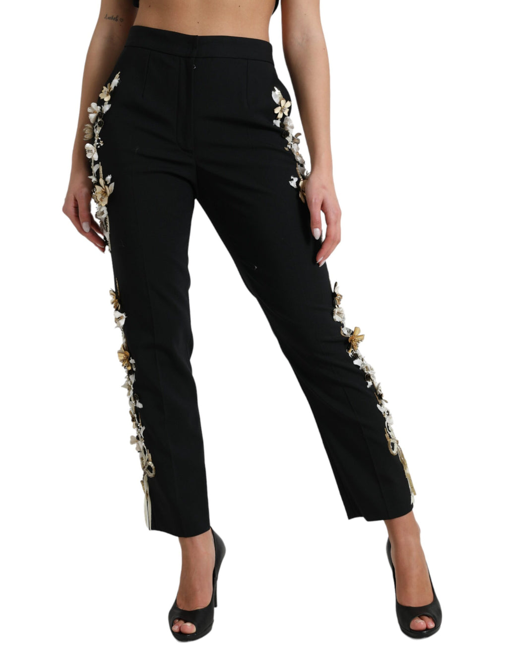Pantalons Dolce & Gabbana noirs à taille haute avec appliqué floral, coupe tapered élégante, en tissu fluide.