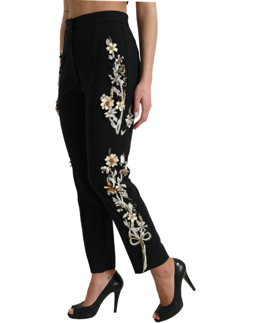 Pantalons Dolce & Gabbana noirs à taille haute avec appliqué floral et coupe tapered, mode élégante pour femmes.