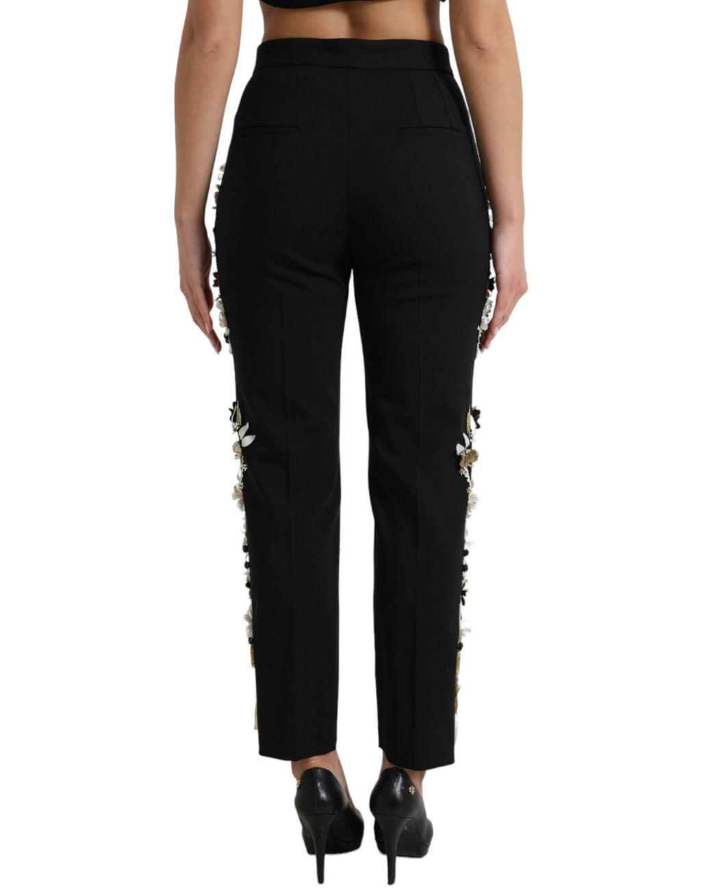 Pantalon noir Dolce & Gabbana à taille haute avec appliqué floral et coupe tapered, élégant et tendance.