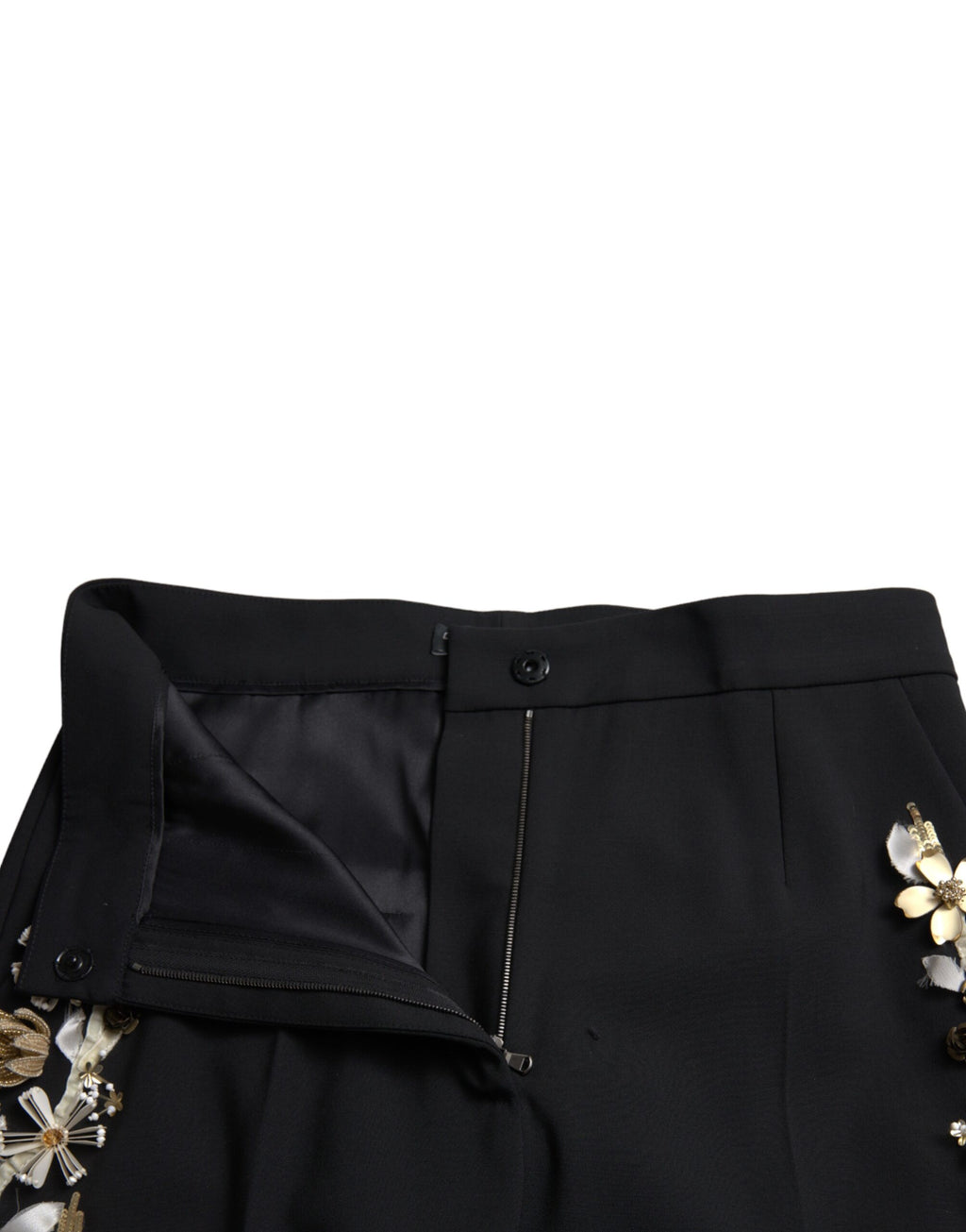 Pantalon noir à taille haute Dolce & Gabbana avec appliqués floraux, coupe tapered, élégant et tendance.