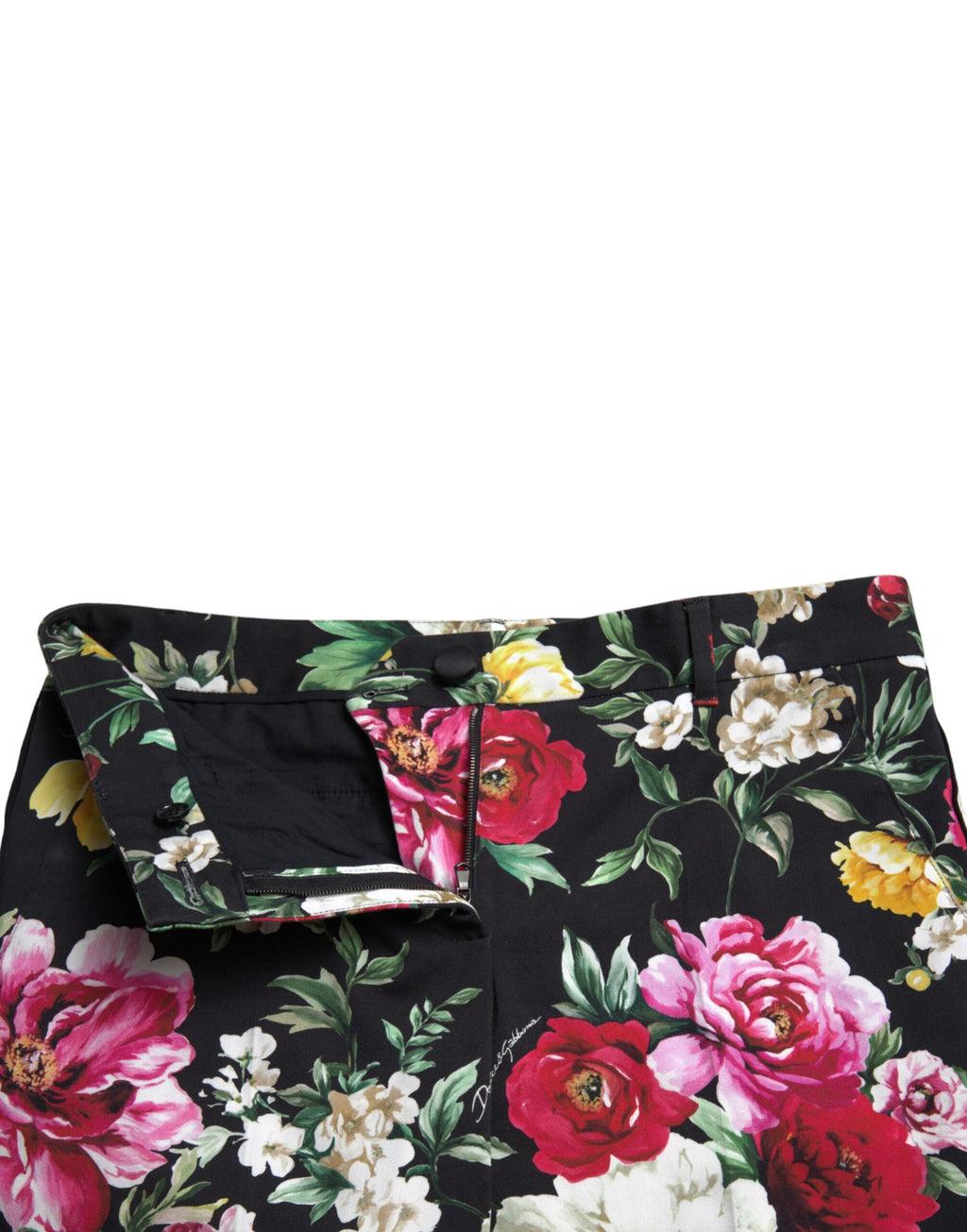 Pantalon cropped noir à taille moyenne Dolce & Gabbana avec imprimé floral élégant, visible sur une mannequin.