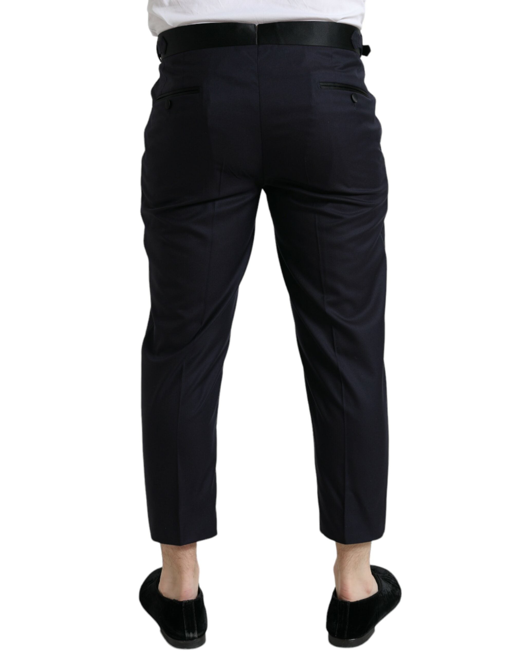 Pantalons en laine bleue Dolce & Gabbana, coupe cropped et tapered, affichant un style élégant et moderne.