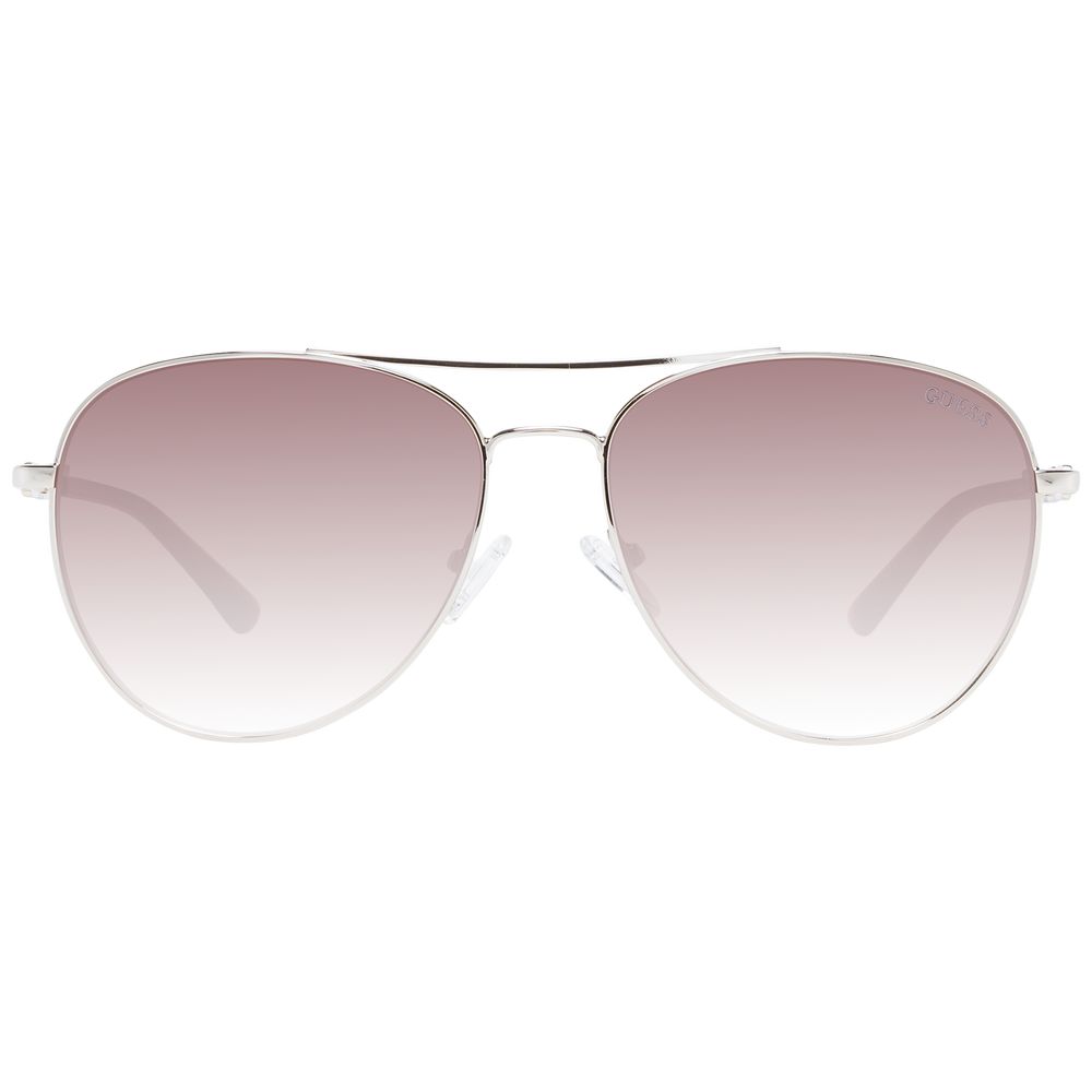 Lunettes de soleil en métal argenté Guess, style tendance, avec monture fine et verres teintés, pour un look élégant et moderne.