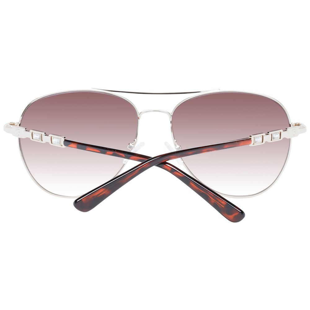 Lunettes de soleil en métal argenté Guess, design élégant avec monture fine et verres teintés, pour un look sophistiqué.