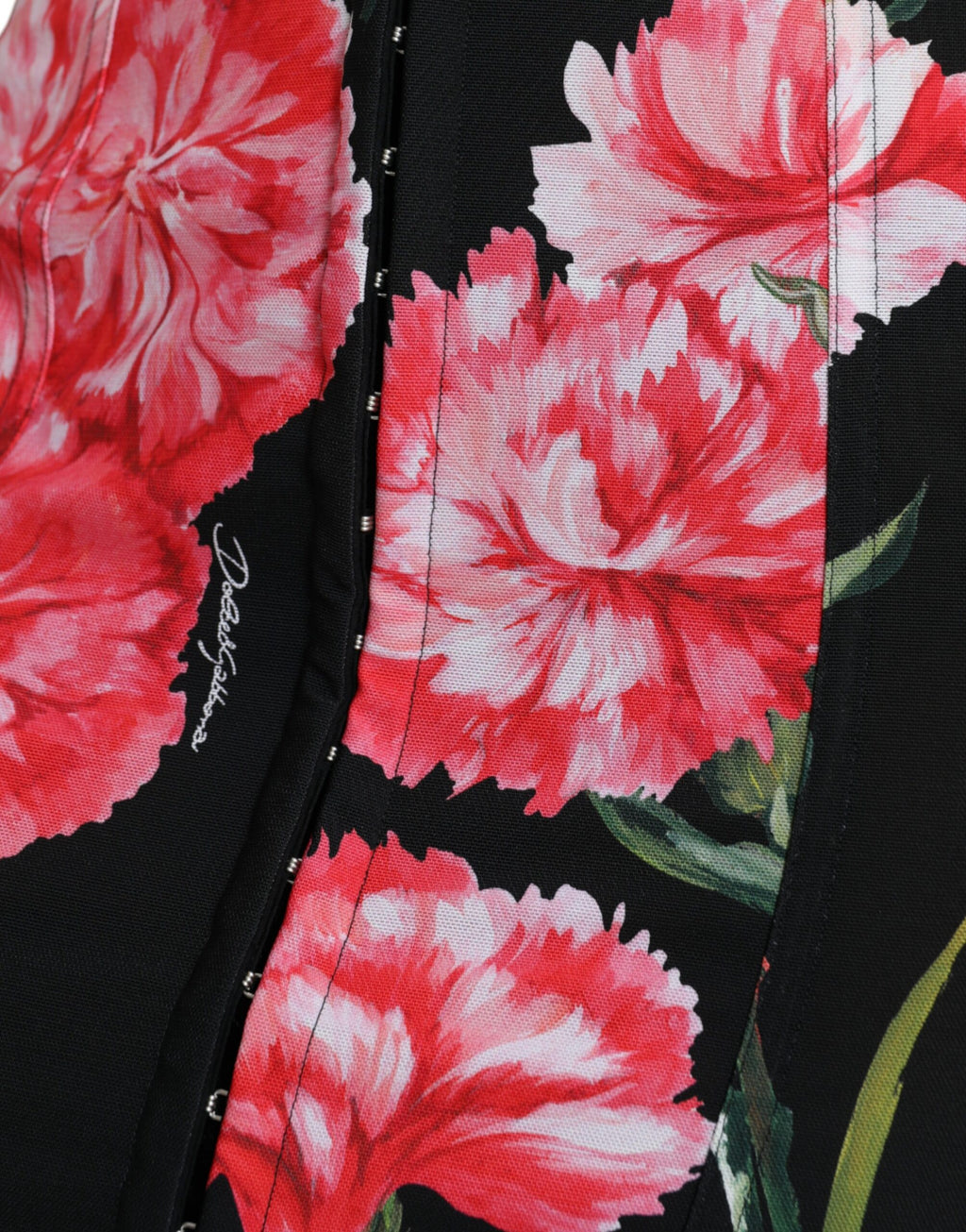 Jupe mi-longue noire Dolce & Gabbana en coton avec coupe pencil et détails floraux de carnations.