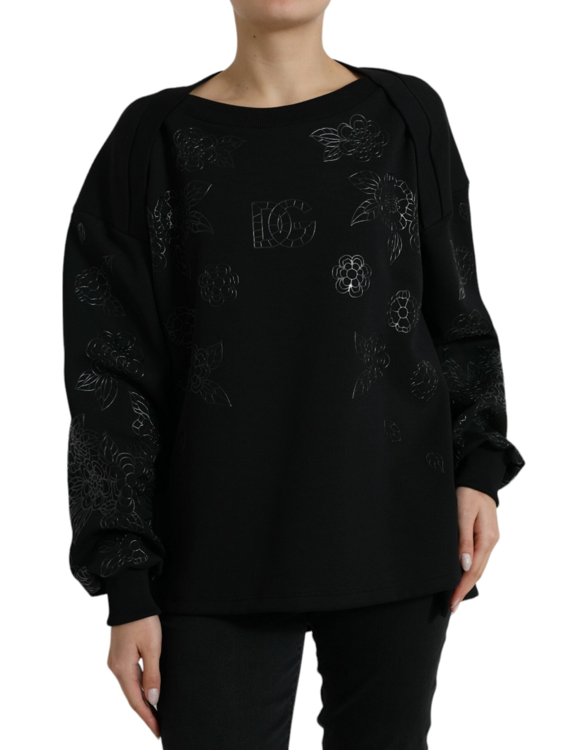 Pull noir Dolce & Gabbana en laine avec logo floral appliqué visible sur la poitrine.