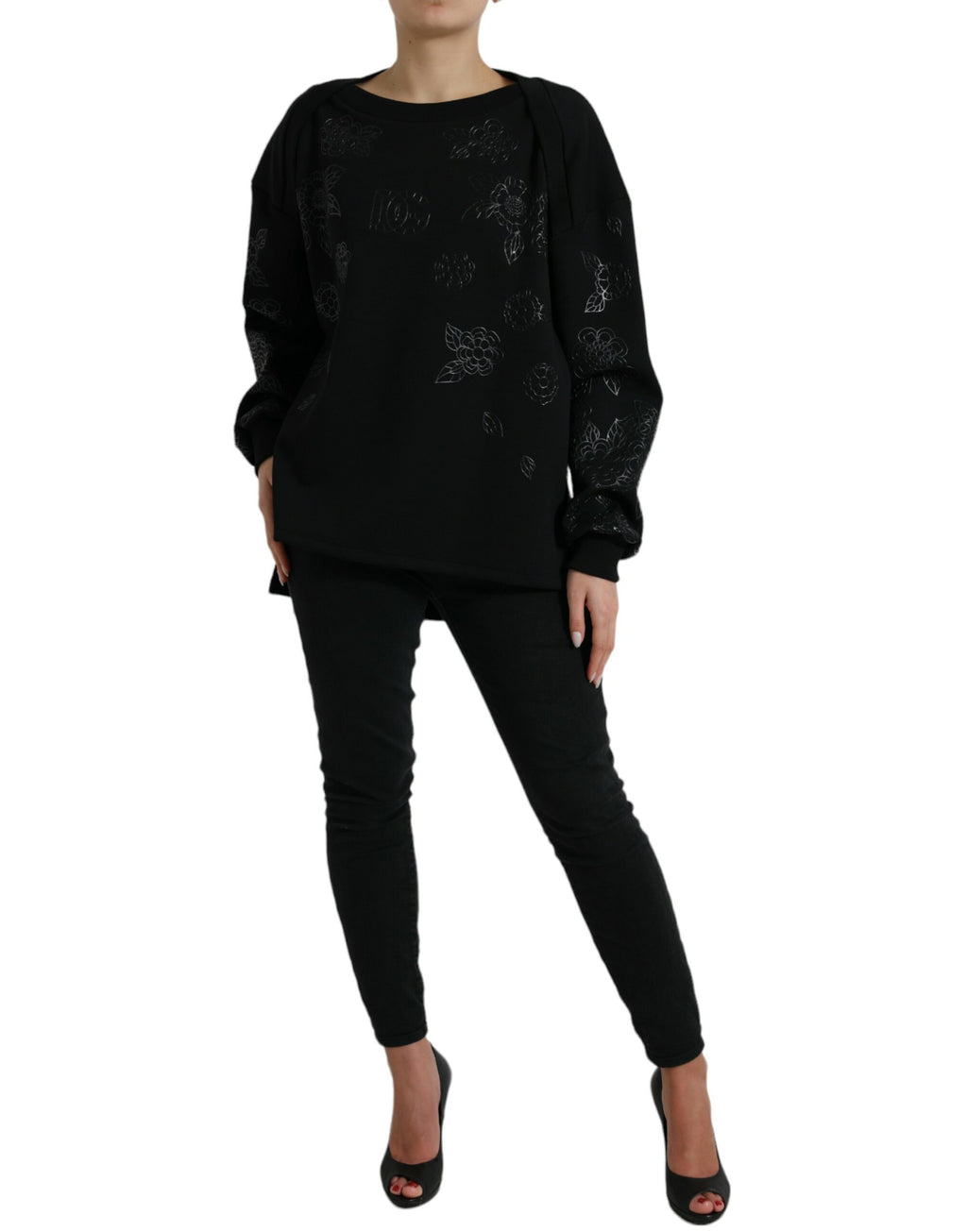 Pull à manches longues Dolce & Gabbana noir avec logo floral appliqué, texture douce et design élégant visible sur l'image.