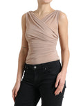 Top sans manches en viscose beige de Dolce & Gabbana avec col en V, porté sur un fond neutre.