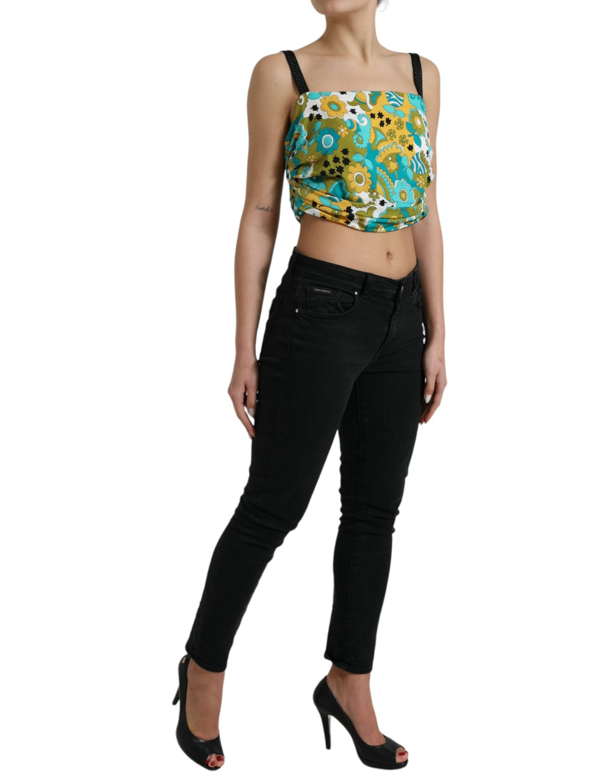 Top sans manches Dolce & Gabbana à fleurs multicolores, coupe courte et style floral élégant, visible en image.