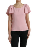 Blouse Dolce & Gabbana rose à manches courtes, col rond, en tissu léger, portée décontractée, vue de face.