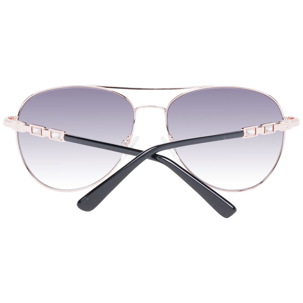 Lunettes de soleil en métal or rose Guess, style moderne avec monture fine et verres teintés, pour un look élégant.
