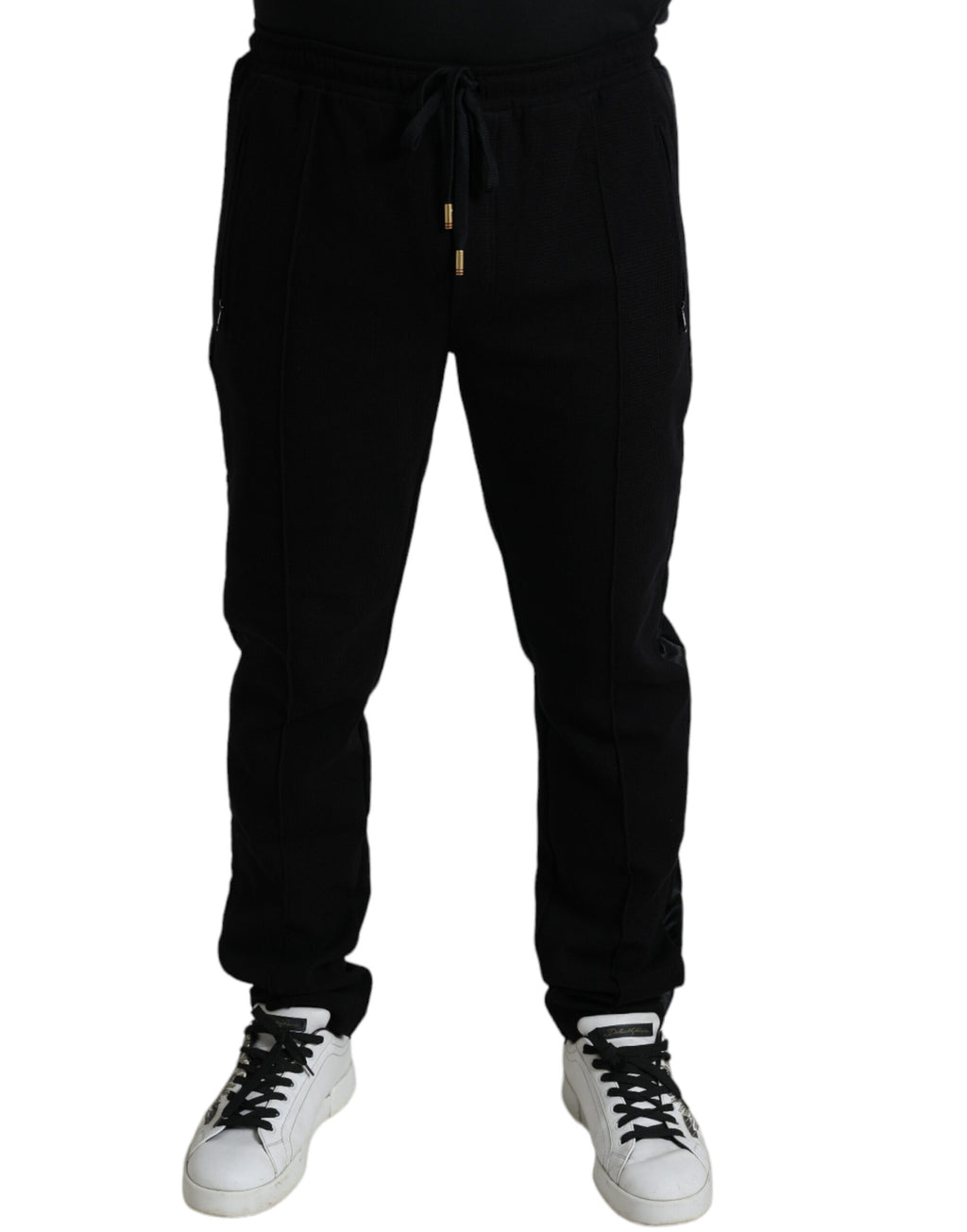 Pantalons jogger skinny en coton noir de Dolce & Gabbana, style décontracté avec ceinture élastique et poches latérales.