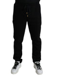 Pantalons jogger skinny en coton noir de Dolce & Gabbana, style décontracté avec ceinture élastique et poches latérales.