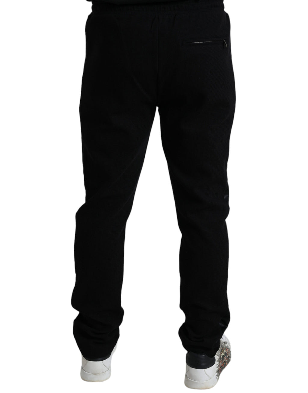 Pantalons joggers skinny en coton noir de Dolce & Gabbana, style décontracté et ajusté, visibles sur l'image.