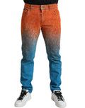 Jeans en denim slim fit Dolce & Gabbana, coton multicolore avec dégradé ombré, visibles détails de couture et style moderne.