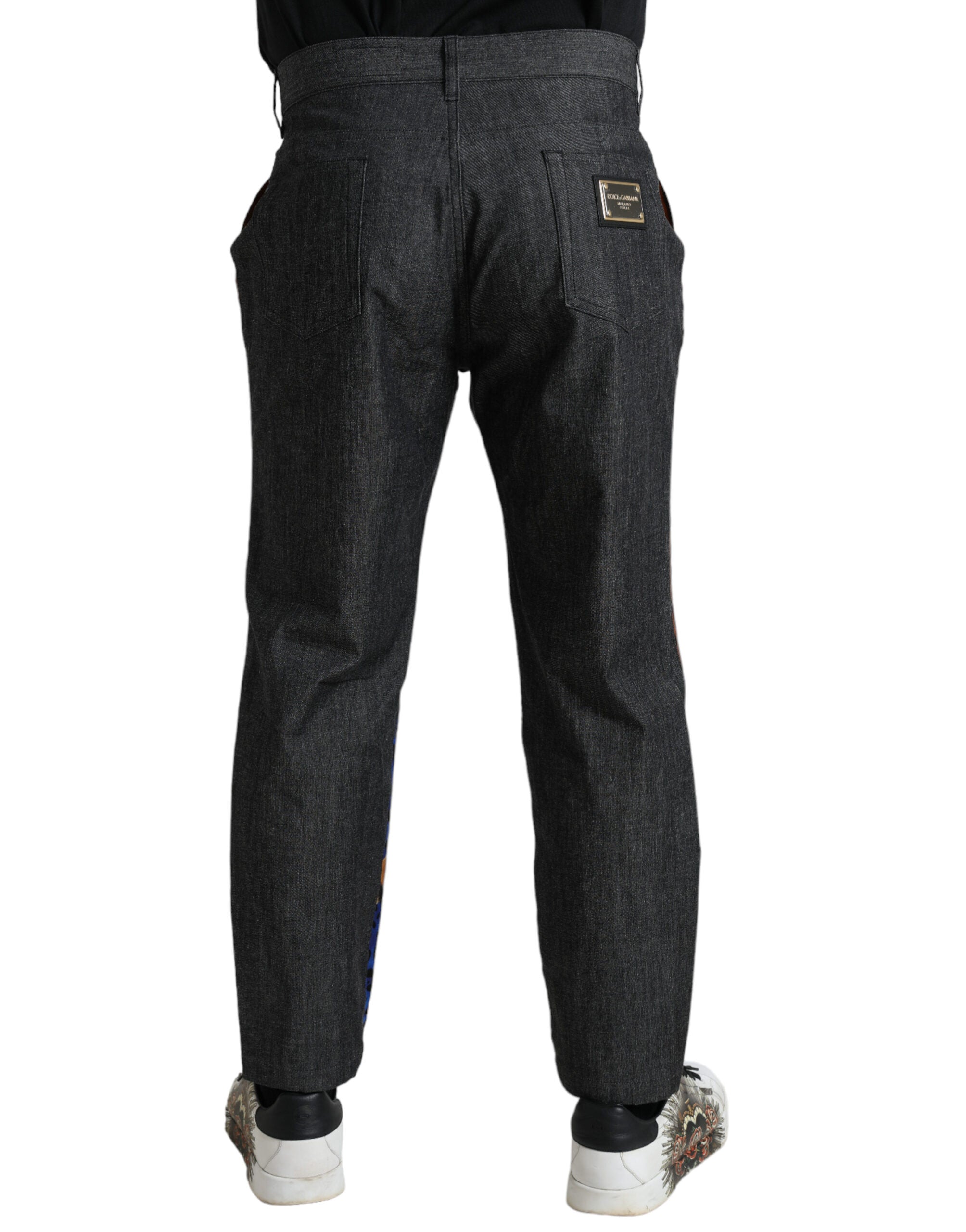 Jeans en denim ample multicolore à tigre de Dolce & Gabbana, coton, avec motif animalier, visibles en image.