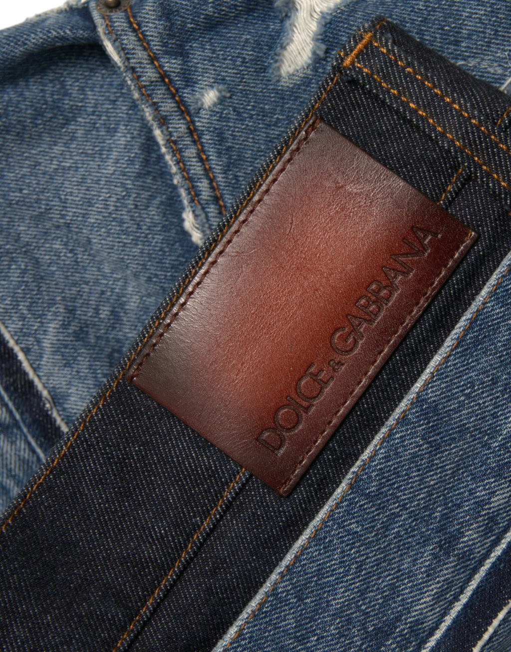 Jeans en denim pour hommes Dolce & Gabbana, coton bleu déchiré, style décontracté et tendance.