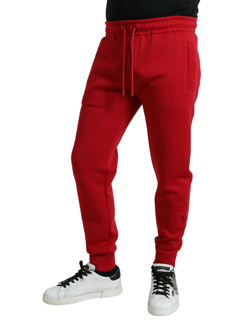 Pantalon jogging skinny en coton mélangé rouge de Dolce & Gabbana, vue de face avec détails de la taille et des jambes.