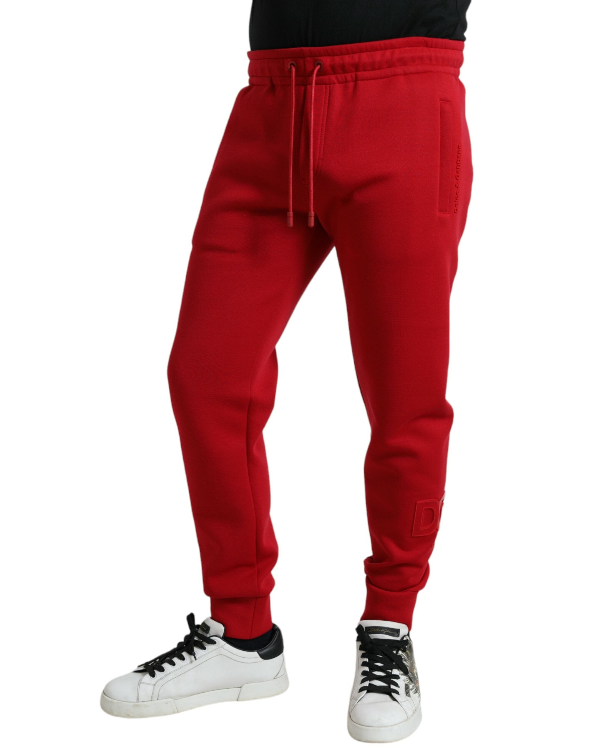Pantalon jogging skinny en coton mélangé rouge de Dolce & Gabbana, vue de face avec détails de la taille et des jambes.