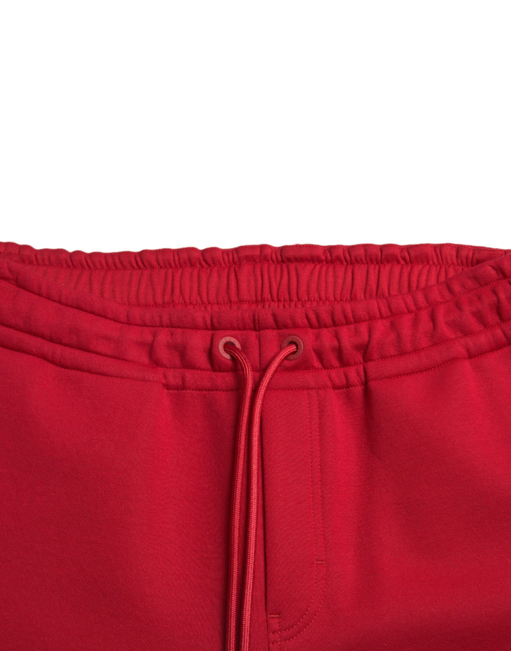Pantalons joggeurs skinny en coton mélangé rouge de Dolce & Gabbana, vue de face avec détails de la taille et des poches