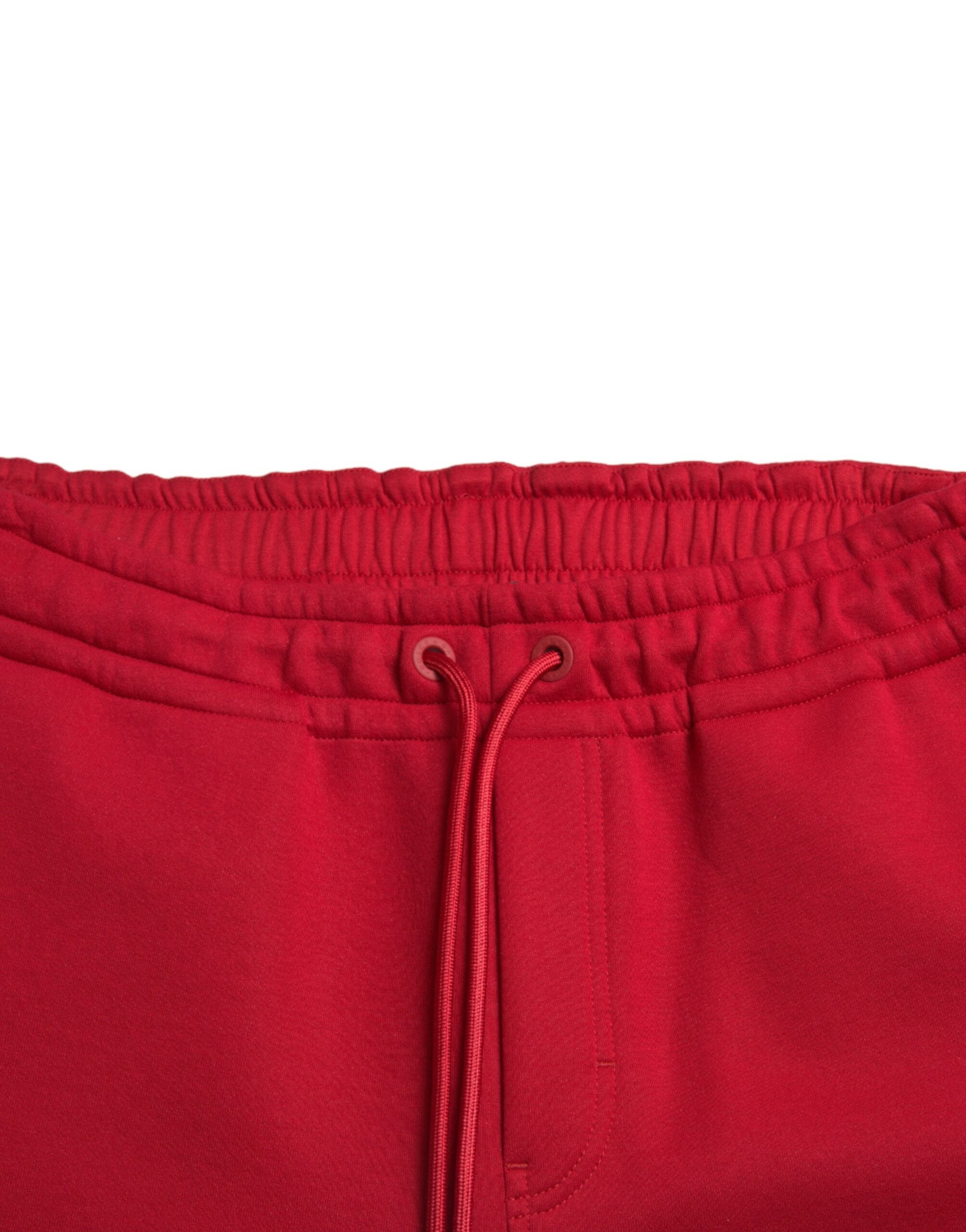 Pantalons joggeurs skinny en coton mélangé rouge de Dolce & Gabbana, vue de face avec détails de la taille et des poches