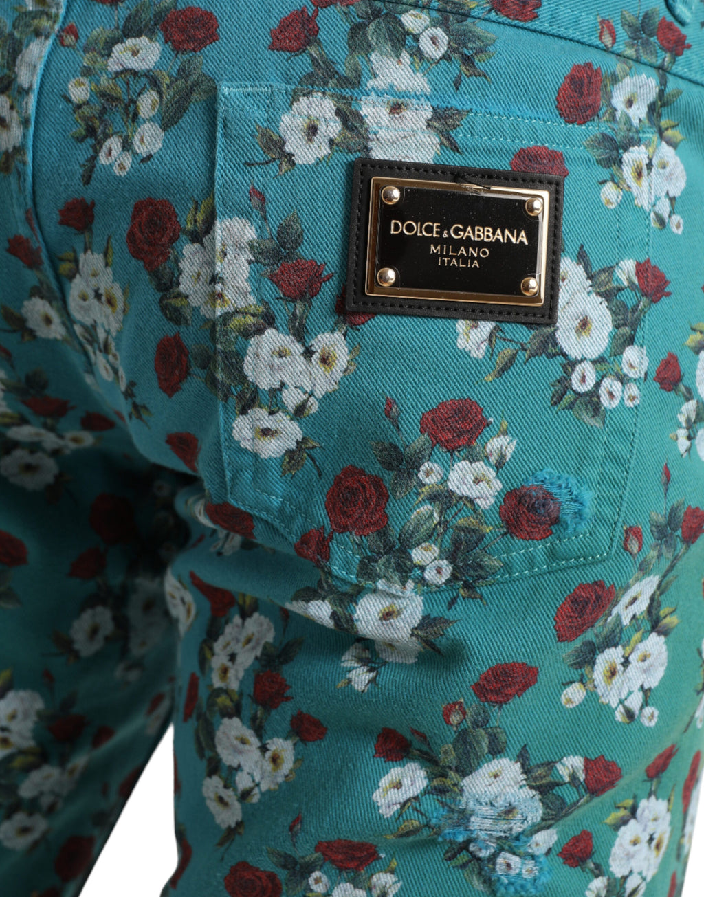 Pantalon skinny en coton denim à imprimé floral bleu de Dolce & Gabbana, style moderne et élégant.