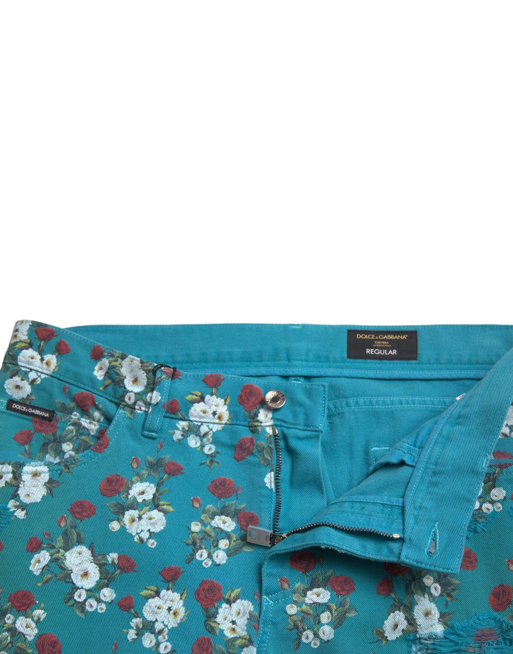 Pantalon skinny en coton denim à fleurs bleues de Dolce & Gabbana, style élégant et moderne.