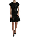 Robe courte noire en dentelle florale en coton de Dolce & Gabbana, coupe évasée et élégante, pour un style sophistiqué.