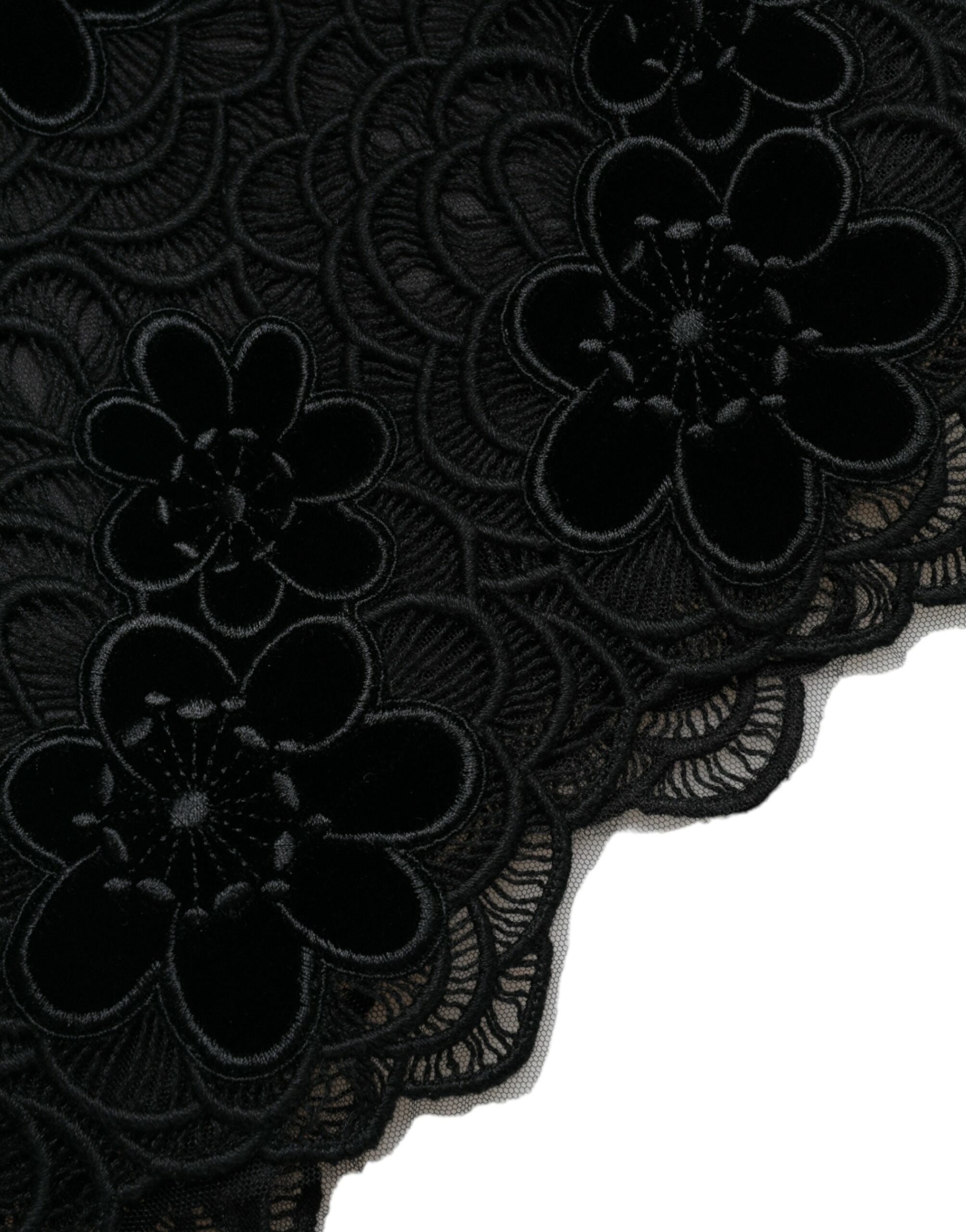 Robe moulante en coton noir avec dentelle florale Dolce & Gabbana, élégante et ajustée, visible avec détails de dentelle sur le devant.