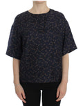 Blouse en soie Dolce & Gabbana à motif clé bleu et or, vêtement élégant avec détails sophistiqués visible sur l'image.