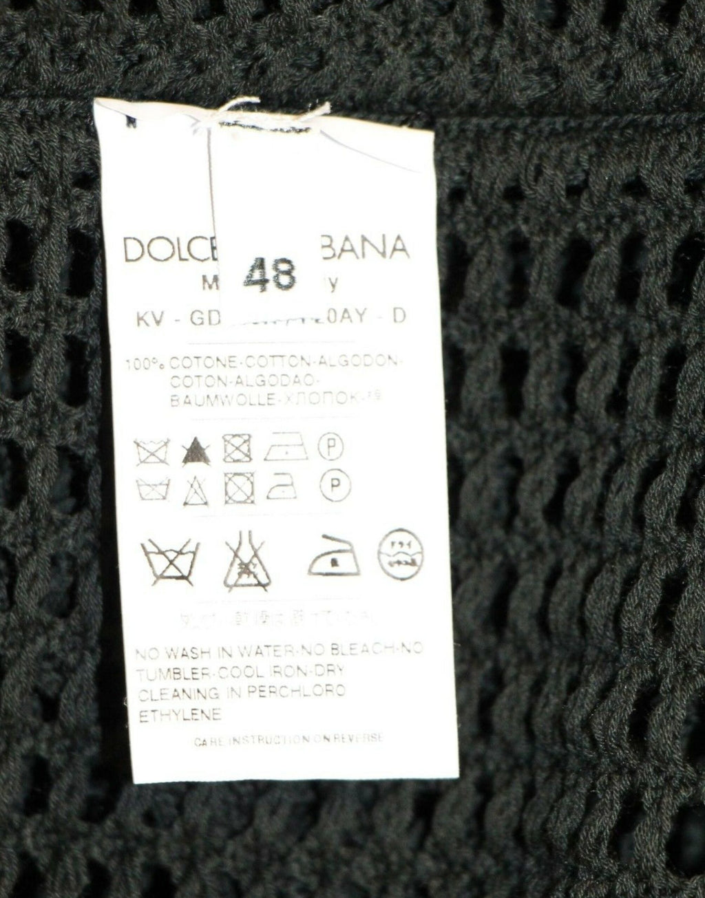 Pull doux & Gabbana vert foncé à mailles, pull-over runway en filet, tissu léger et élégant, présenté en gros plan.