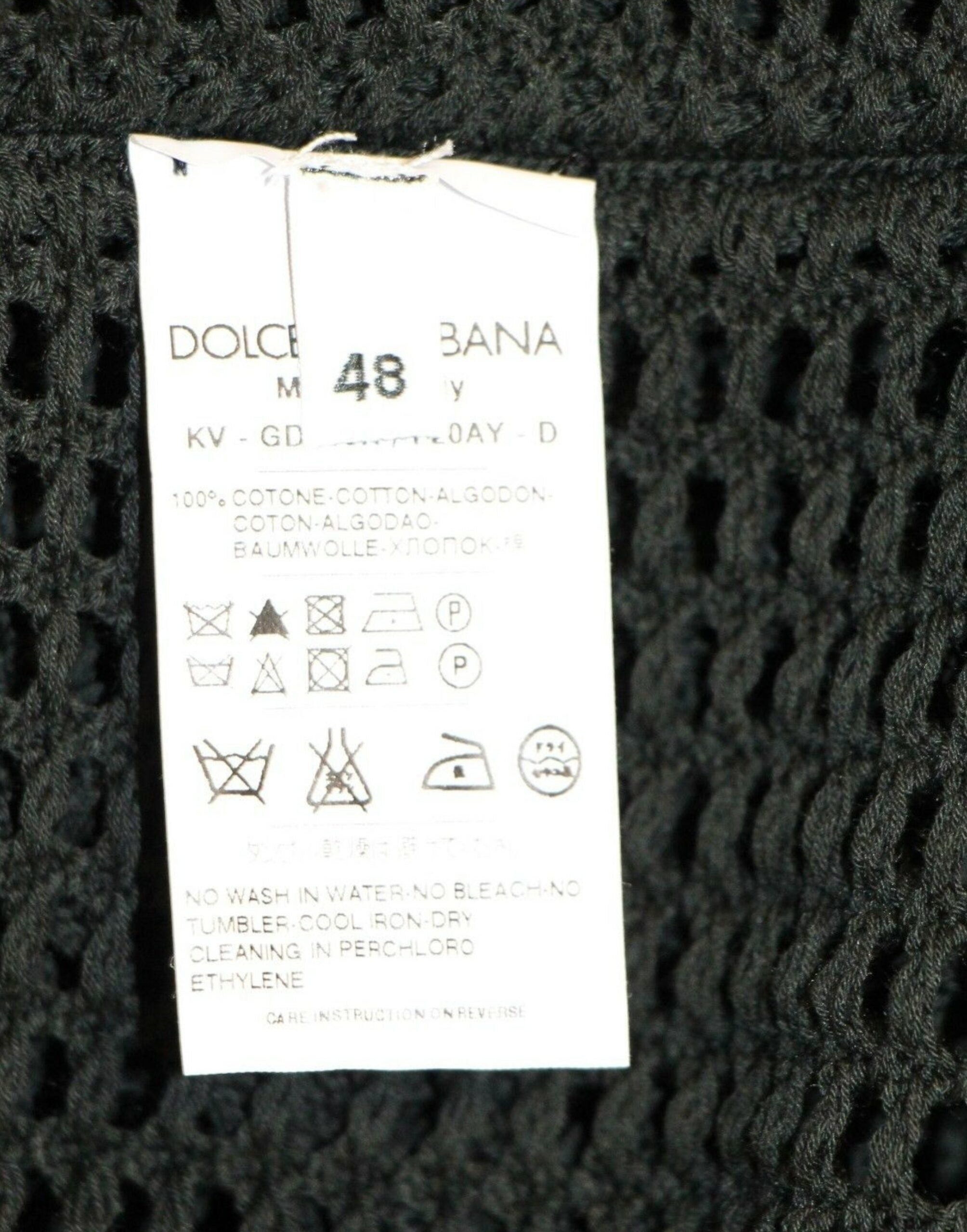 Pull doux & Gabbana vert foncé à mailles, pull-over runway en filet, tissu léger et élégant, présenté en gros plan.