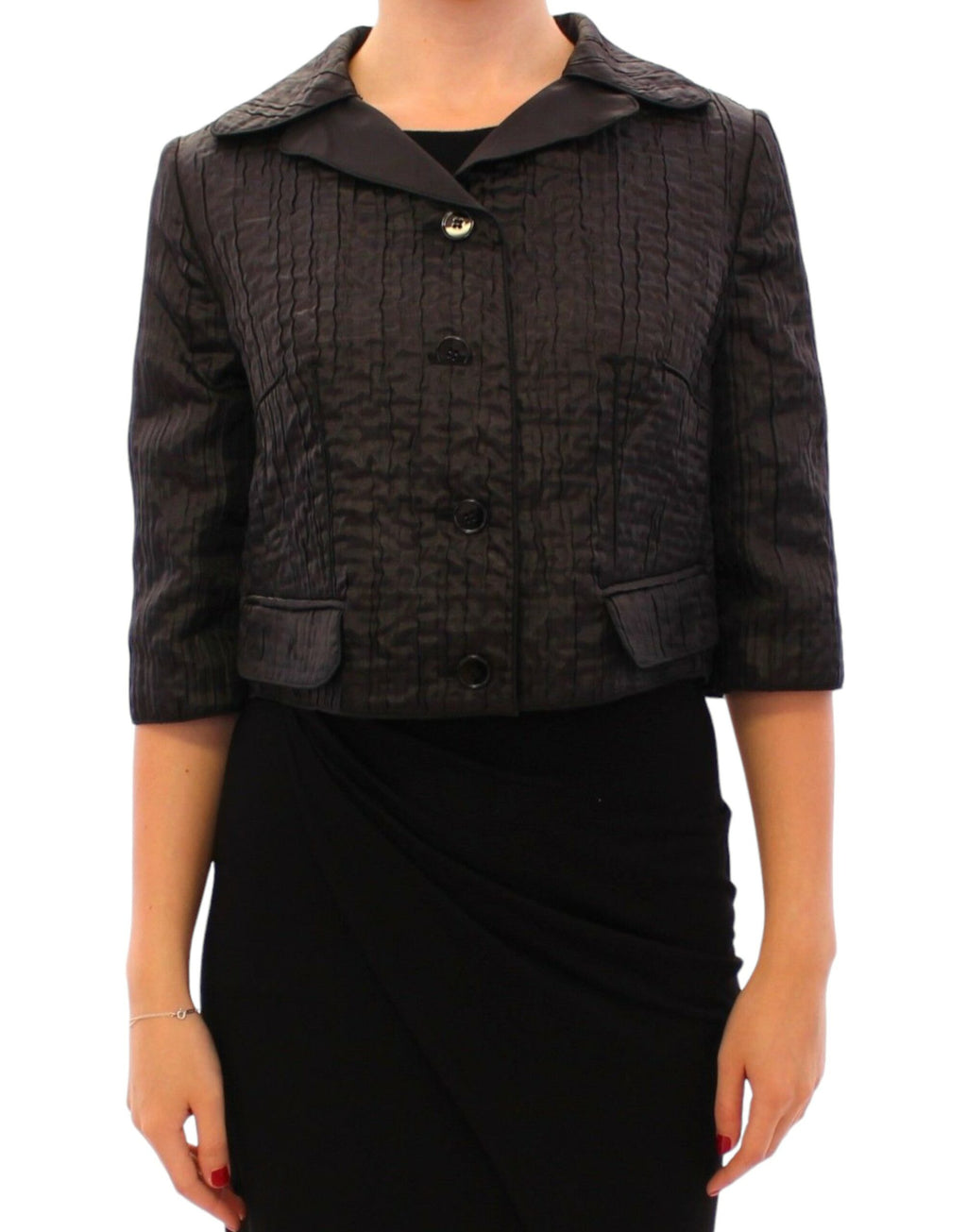 Boléro court noir Dolce & Gabbana, veste shrug élégante en tissu léger, porté sur un haut chic.