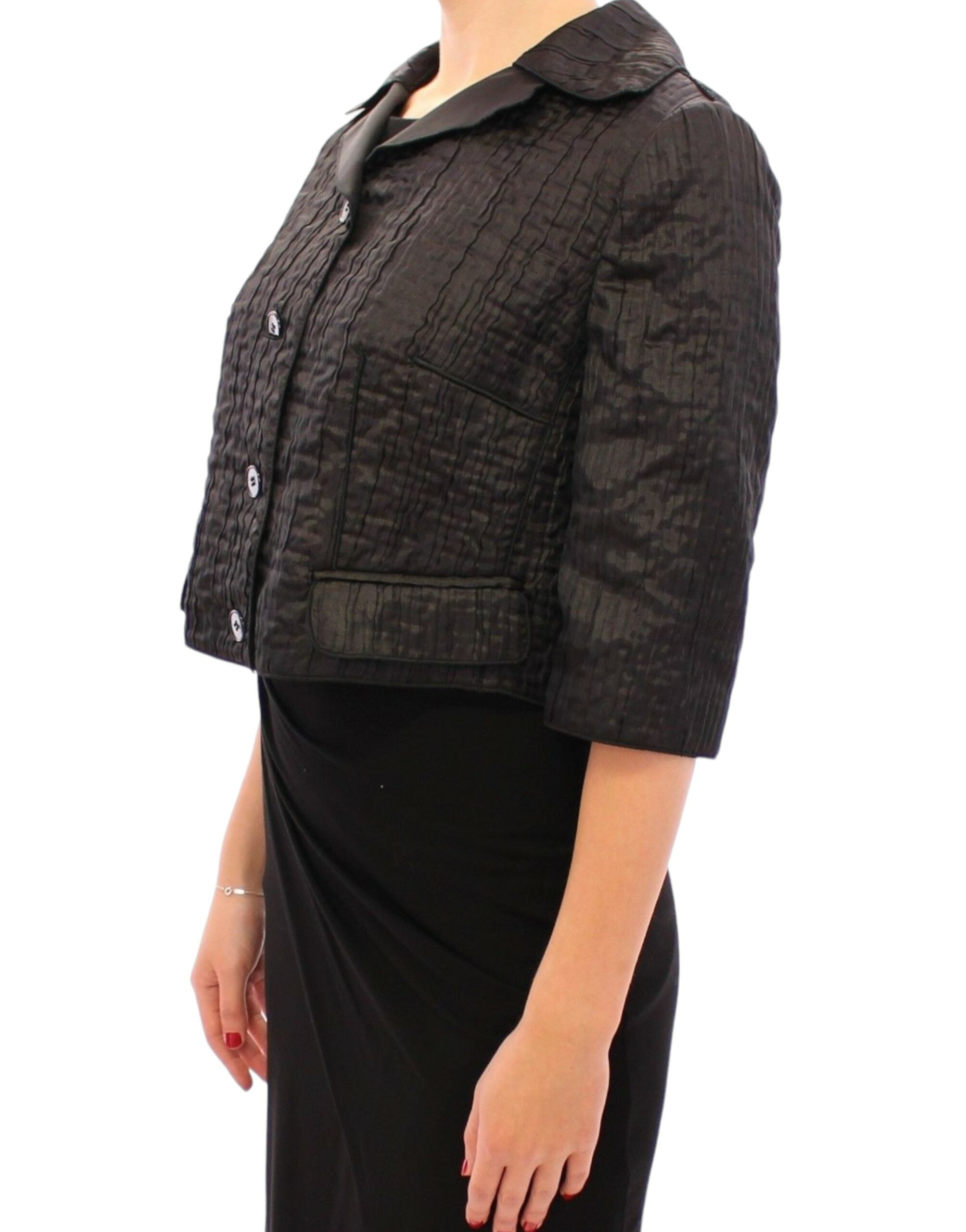 Veste courte Dolce & Gabbana en noir, boléro ou shrug, avec finition élégante et tissu sophistiqué.