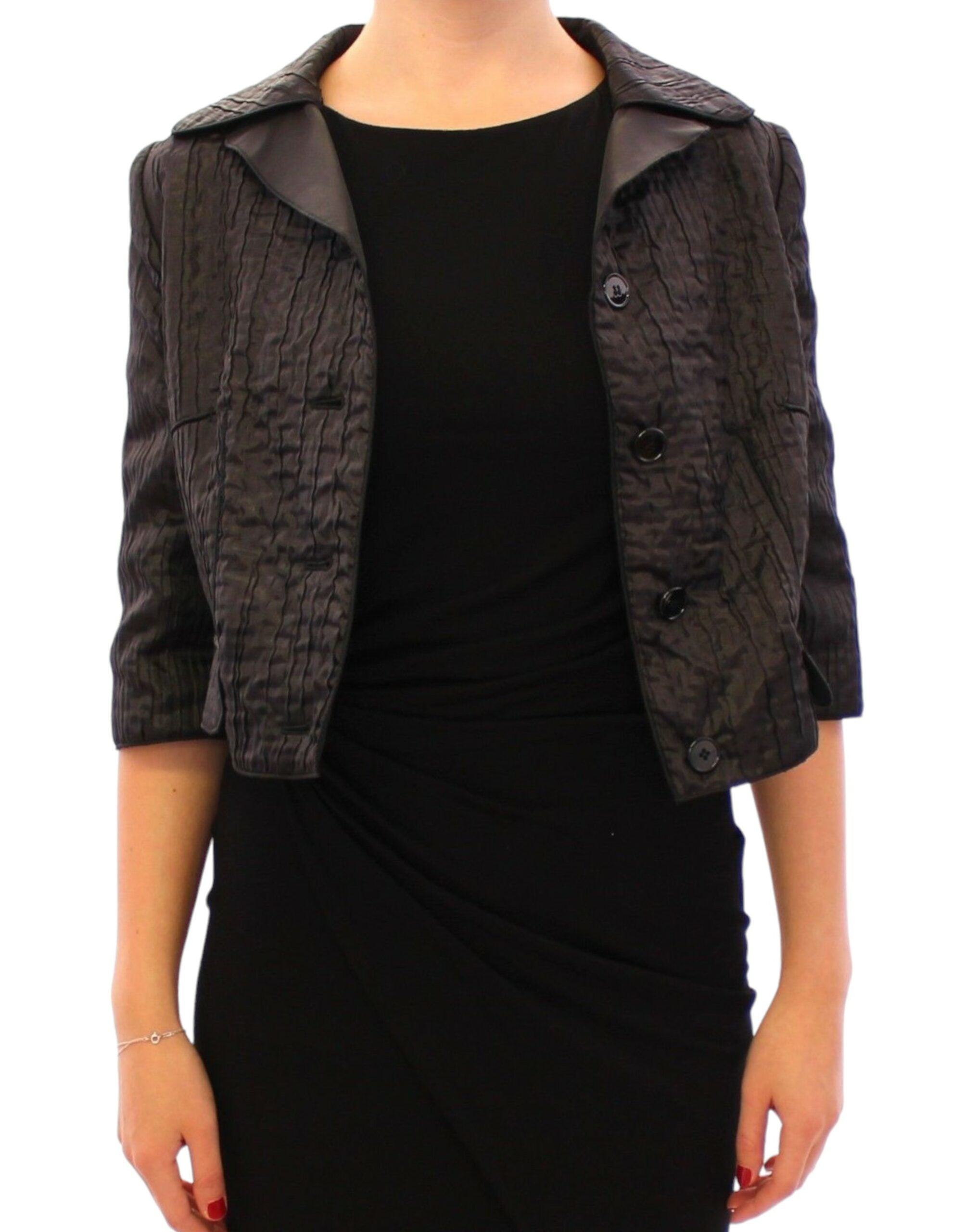 Veste boléro courte noire Dolce & Gabbana en tissu chic, avec manches courtes et design élégant.