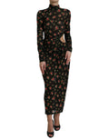 Robe longue noire à fleurs et découpes Dolce & Gabbana, robe de soirée élégante avec coupe ajustée et détails floraux.