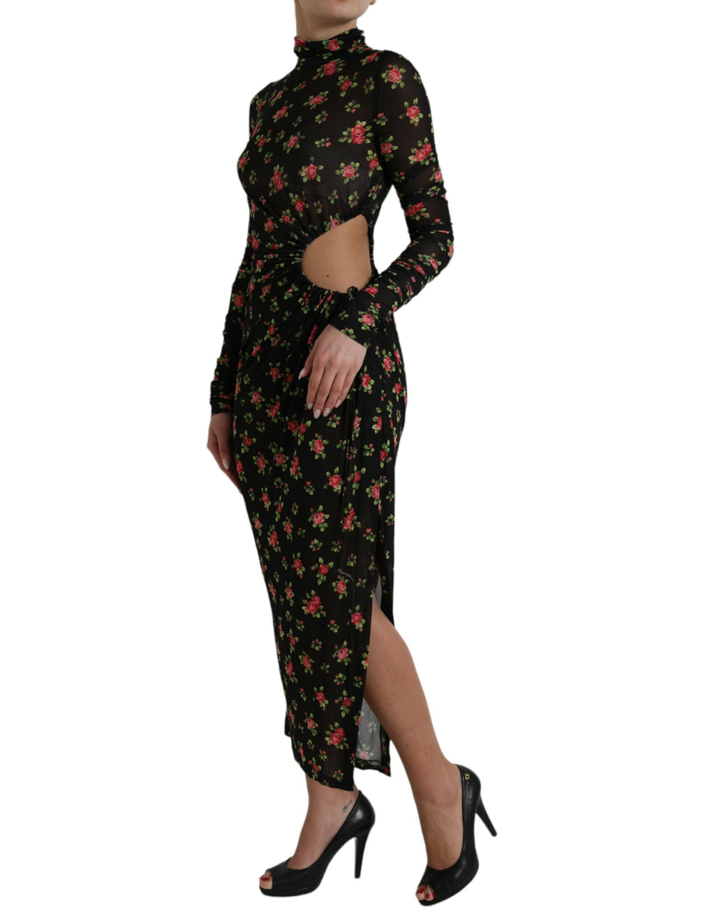 Robe longue noire Dolce & Gabbana à fleurs avec découpes, robe de soirée élégante et moulante, tissu fluide et détails floraux.