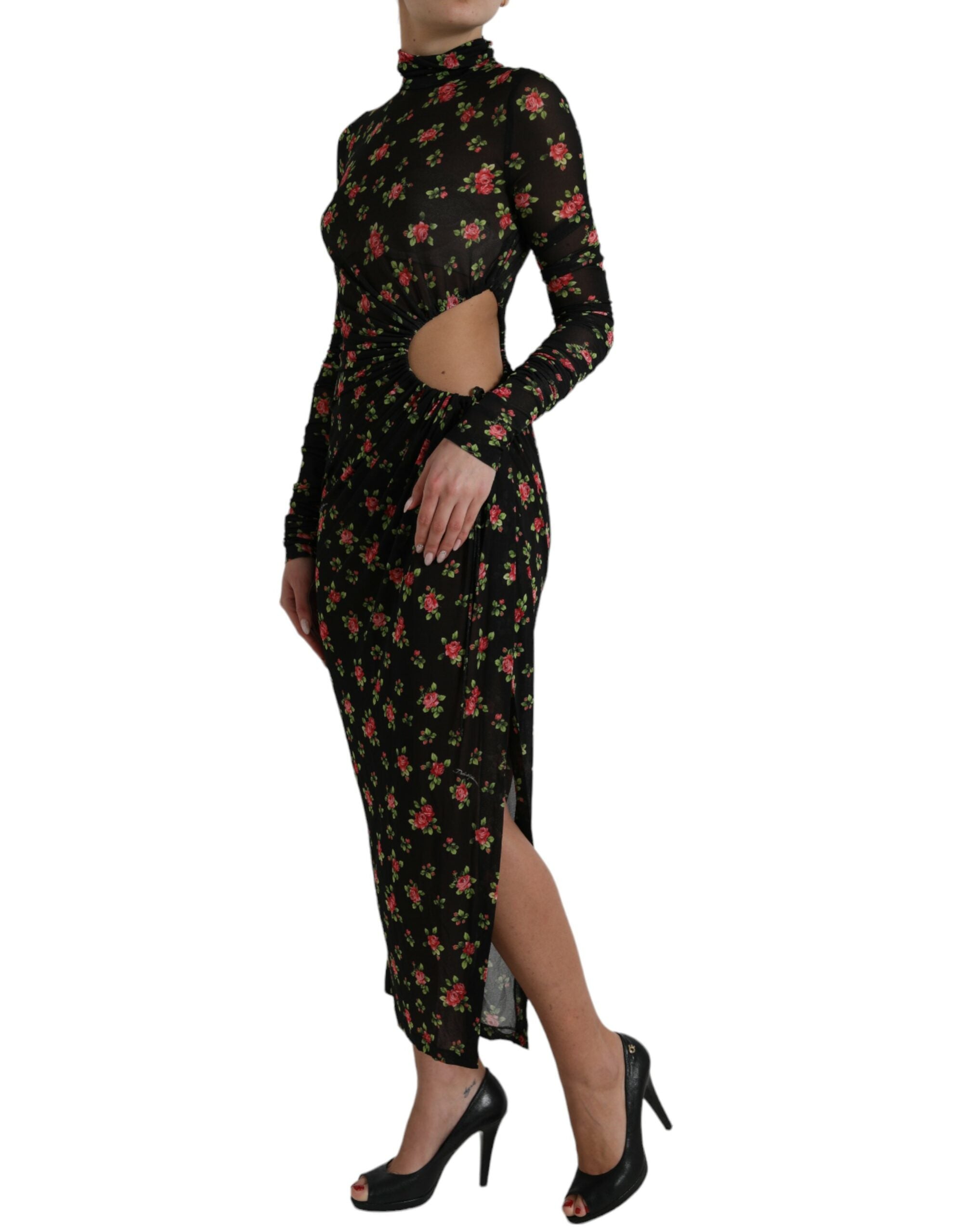 Robe longue noire Dolce & Gabbana à fleurs avec découpes, robe de soirée élégante et moulante, tissu fluide et détails floraux.