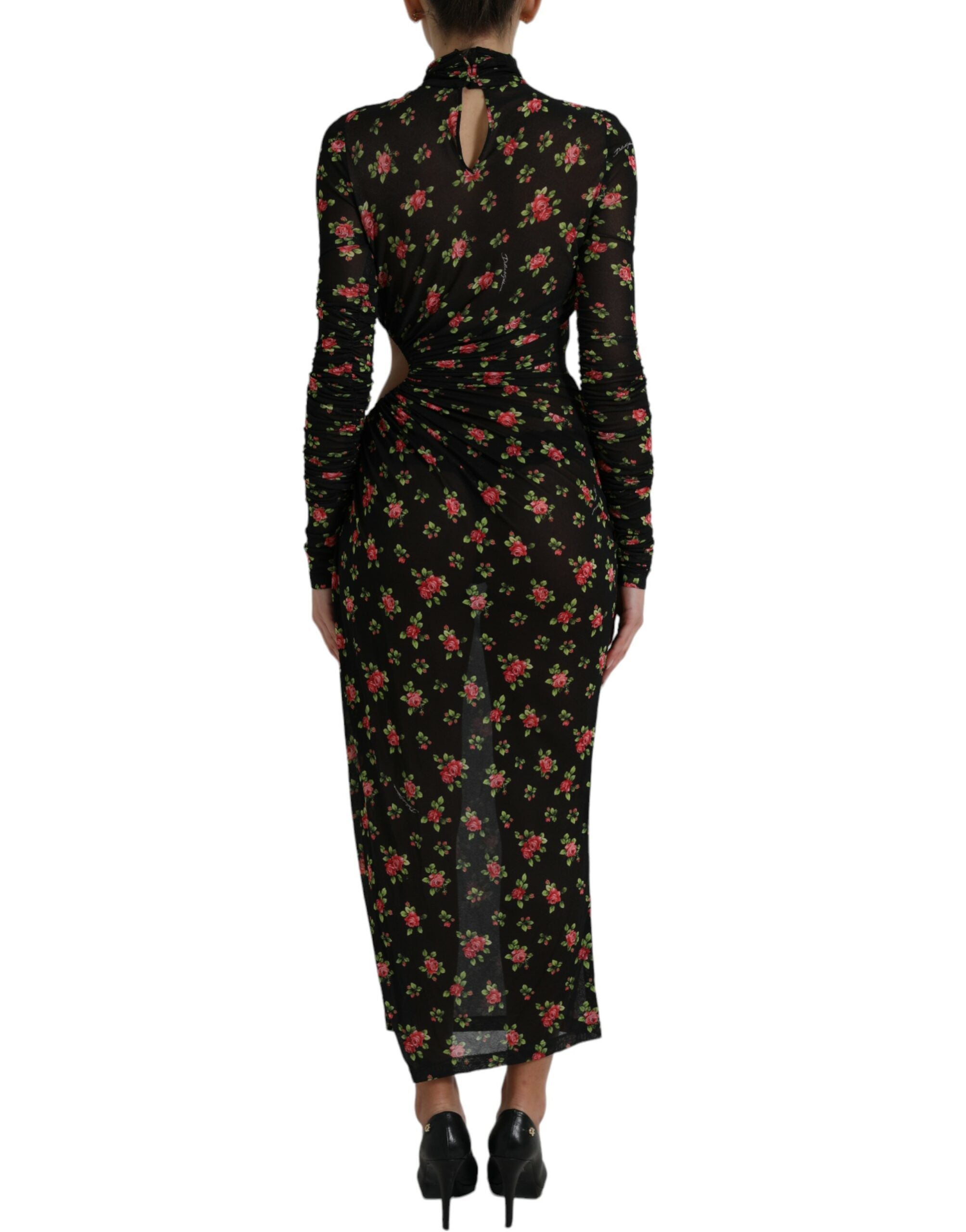 Robe longue noire à fleurs Dolce & Gabbana, coupe moulante avec découpes élégantes, robe de soirée sophistiquée.