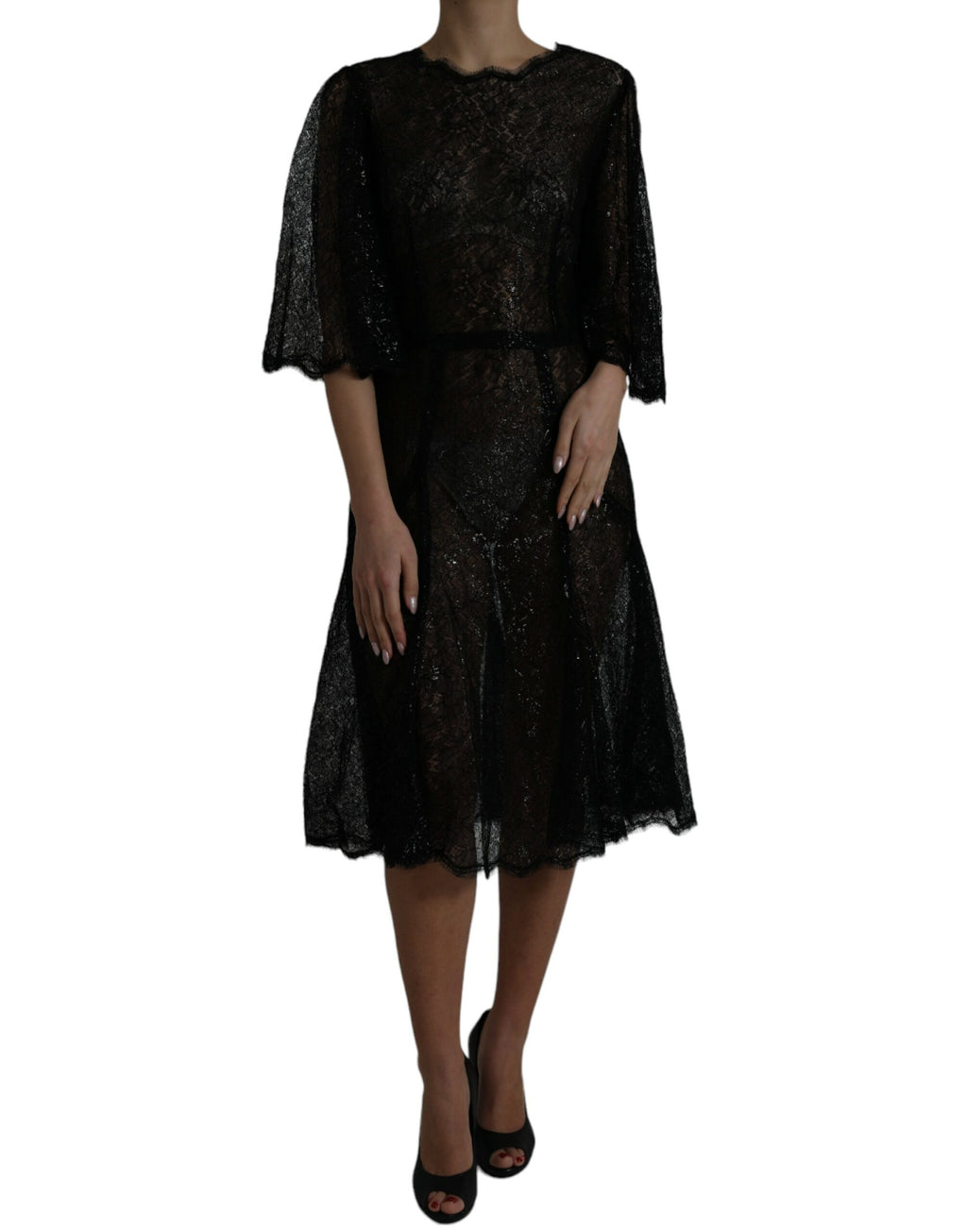 Robe mi-longue en dentelle florale noire de Dolce & Gabbana, style évasé et transparente, pour une allure élégante et sophistiquée.