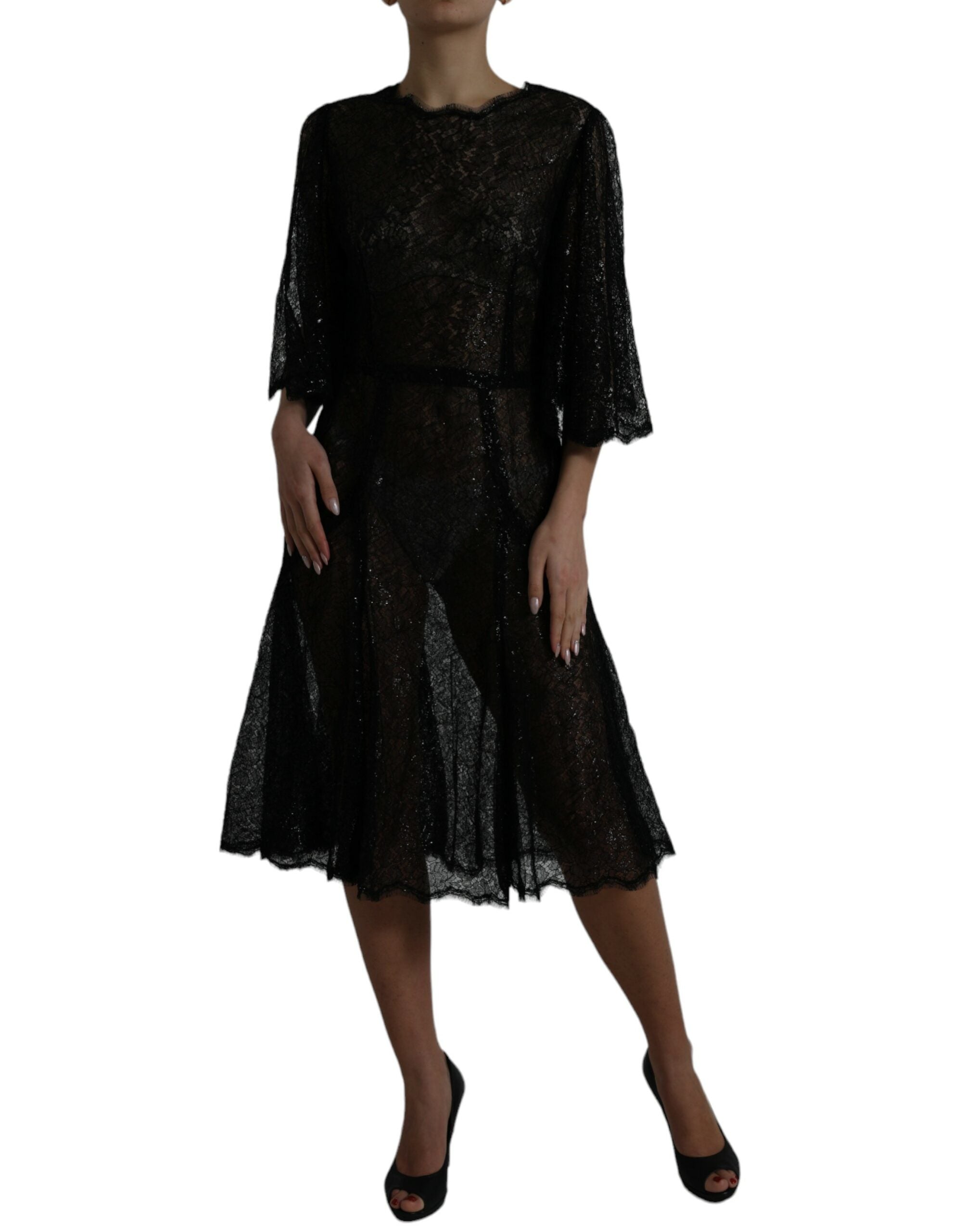 Robe mi-longue en dentelle florale noire de Dolce & Gabbana, coupe évasée et transparente, élégante et sophistiquée.