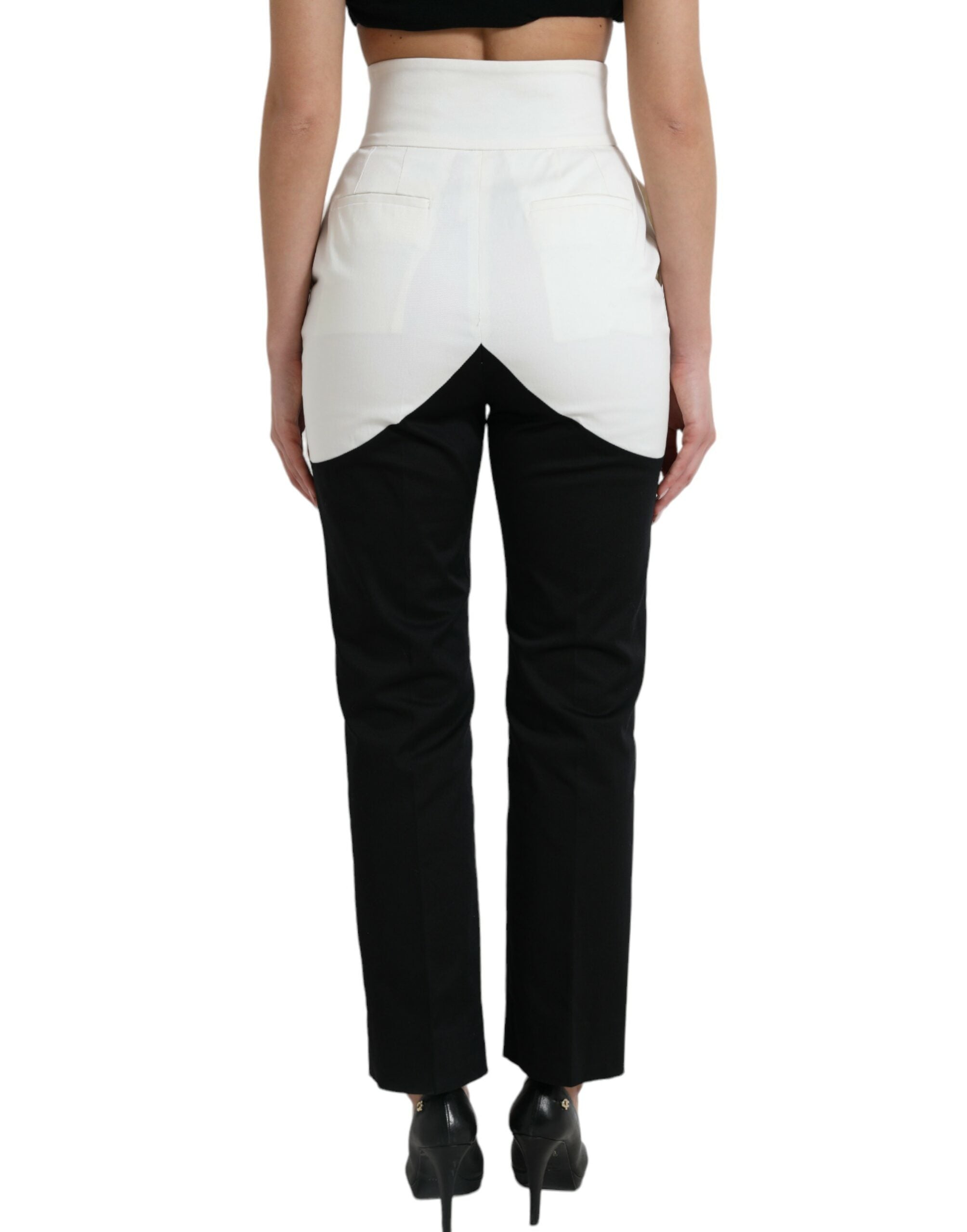 Pantalons tapered en coton noir et blanc de Dolce & Gabbana avec découpe à la taille, ajustés et élégants.